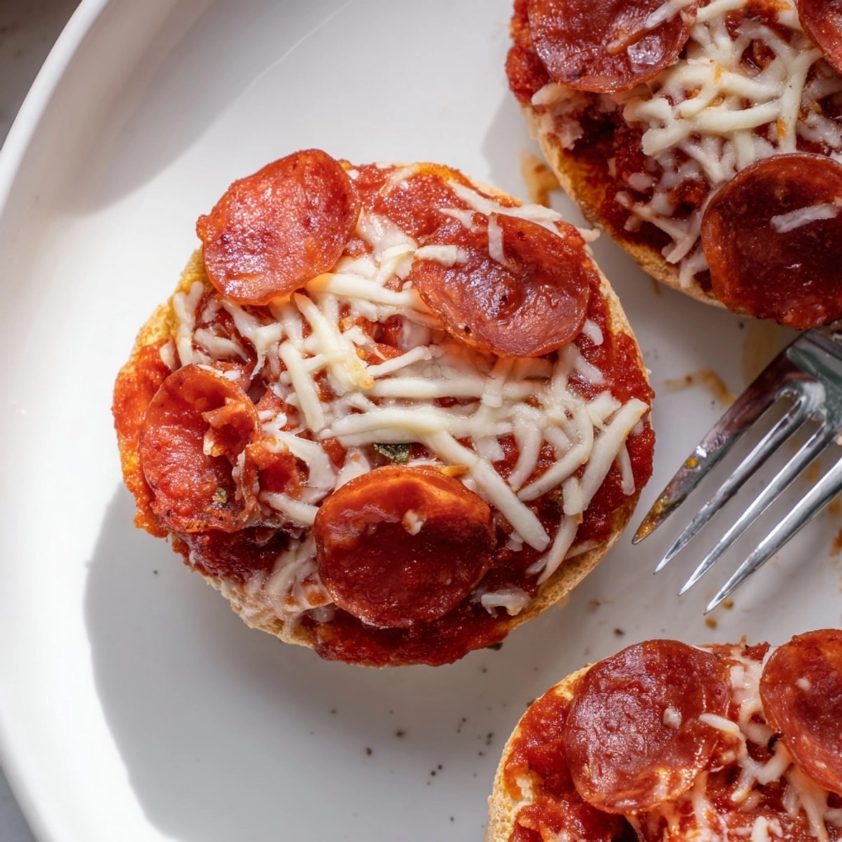 Golden, bubbly Pizza Bagel Bites recipe, perfect for a quick and fun kid-friendly snack.