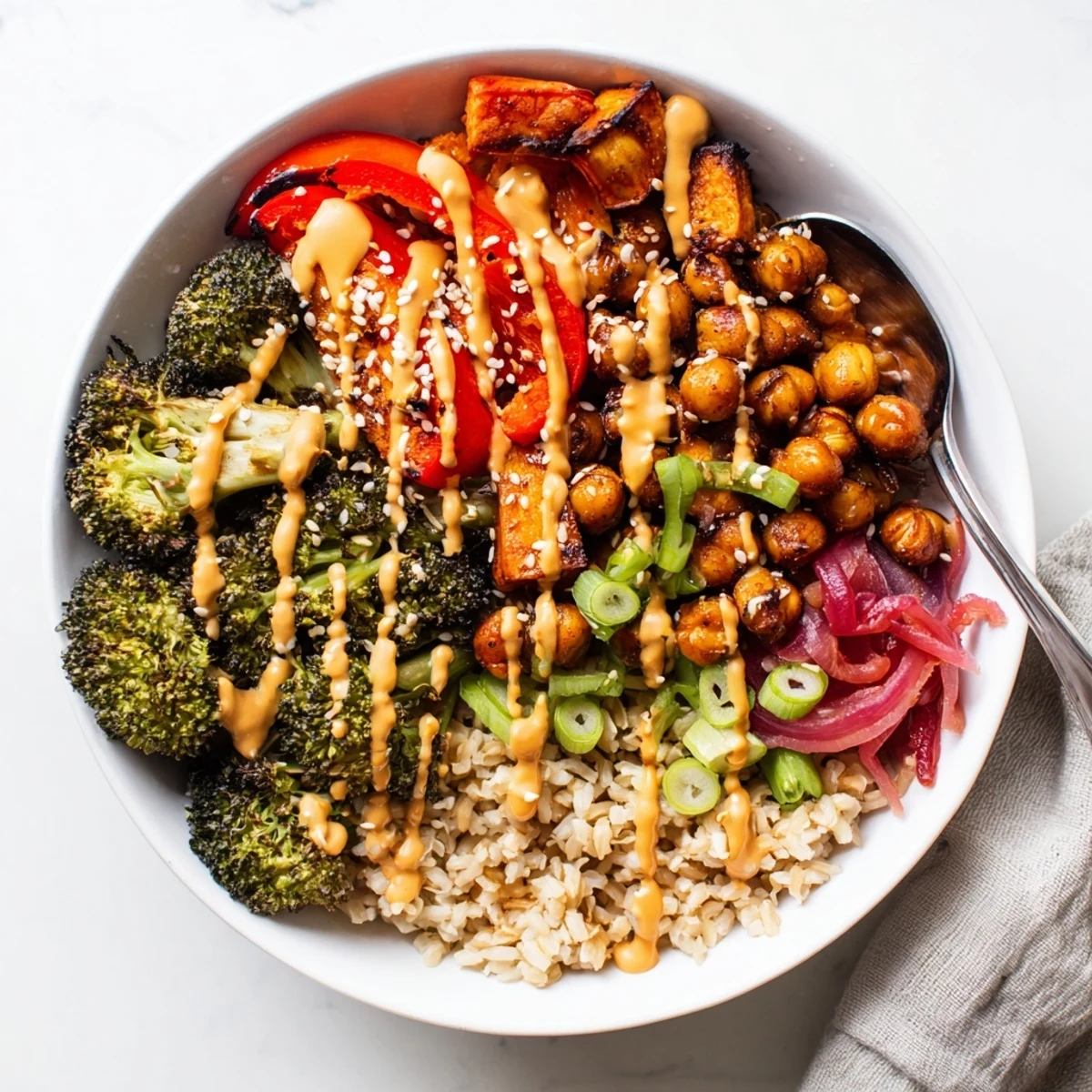 Vibrant Bold Sauce Drizzle Bowls topped with roasted veggies and flavorful sauces.