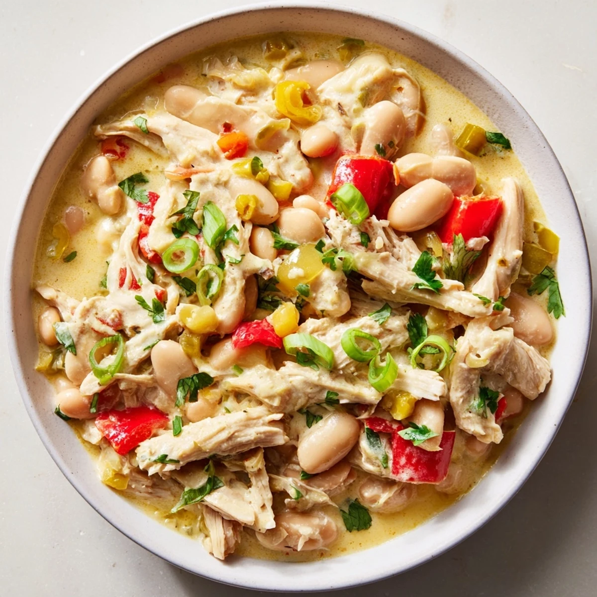 Creamy white chicken chili with beans, a hearty and flavorful chili with tender chicken and creamy goodness.
