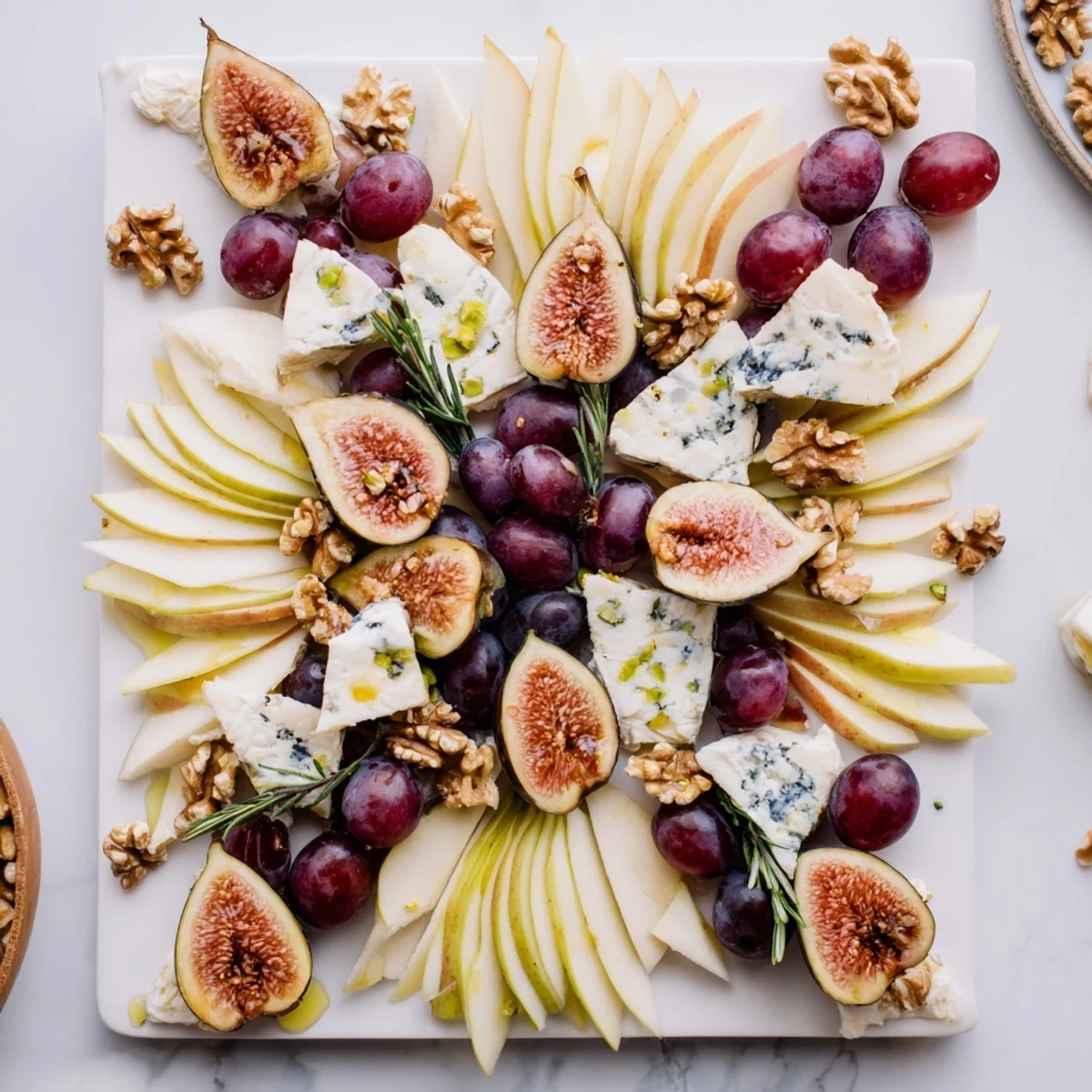 A beautifully arranged Fig and Walnut Star Board appetizer, featuring fresh figs, drizzled maple syrup, and tasty walnuts.