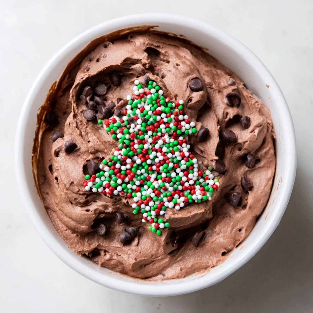 Festive Tree Brownie Dip, creamy and chocolatey, ready to scoop with fresh strawberries and graham crackers.