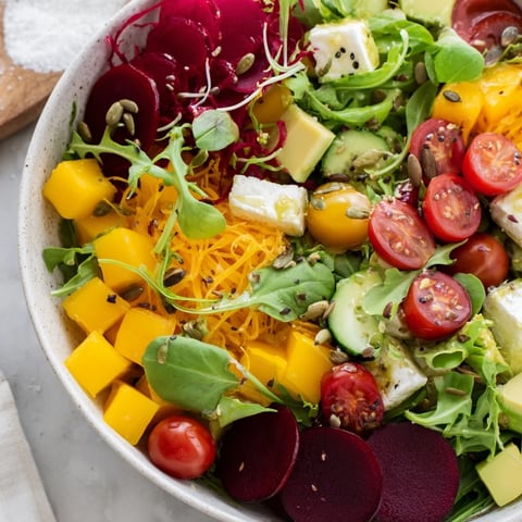 Abstract Expressionist Splash salad showcases bright tomatoes, beets, and cucumber ribbons artistically.