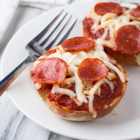 Easy Pizza Bagel Bites recipe: melty mozzarella and pepperoni on toasted mini bagels.