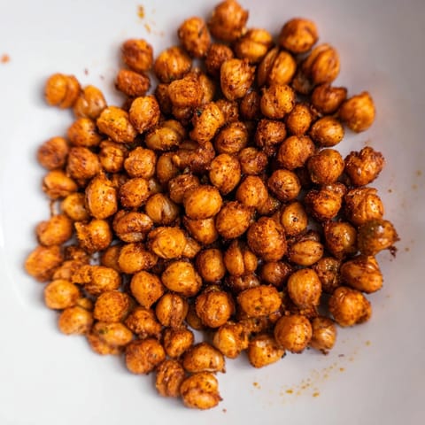 Golden ranch roasted chickpeas, fragrant with herbs, fresh from the oven and slightly oiled.