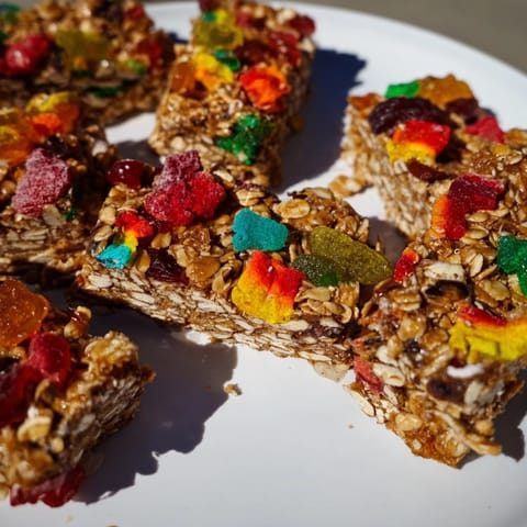 Homemade gummies and crunchy freeze-dried treats on chewy oat snack bars  