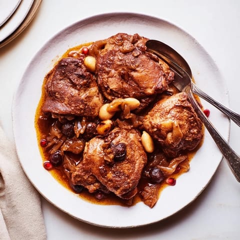 A flavorful bowl of Budget Fesenjan Stew served over fluffy basmati rice, ready to enjoy.