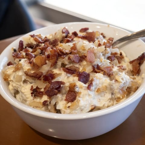 Smoky bacon and sweet caramelized onions blend in this irresistible, easy dip recipe.