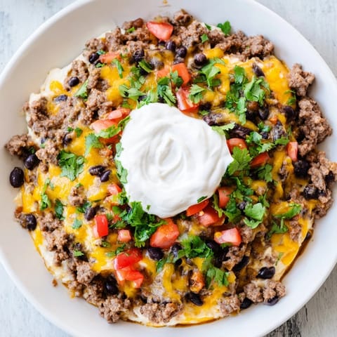 A close-up of Slow Cooker Cream Cheese Taco Dip, creamy and flavorful, perfect for sharing with friends.