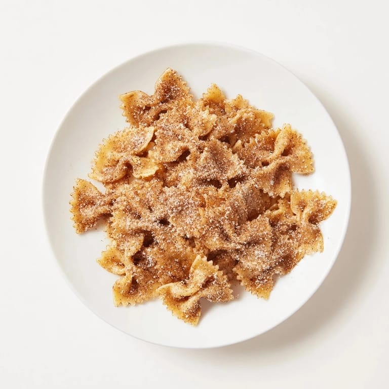 Crunchy, air-fried bowtie pasta forms an irresistible Christmas Crack snack, coated in cinnamon sugar.